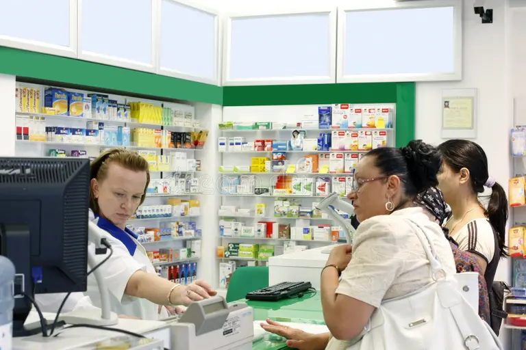 customers inside pharmacy shop 18506962